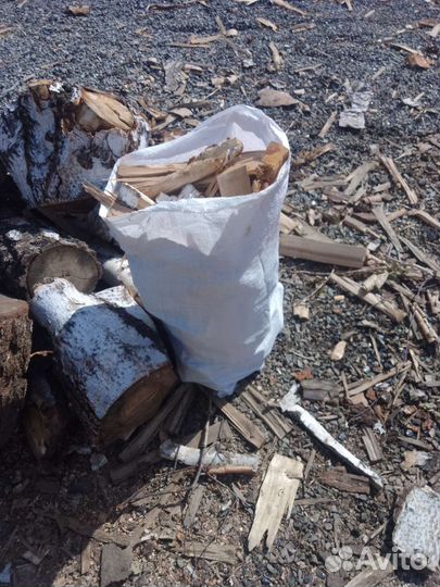 Дрова щепки в мешках