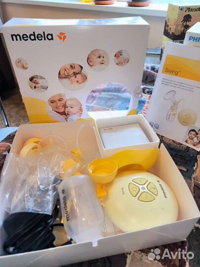 Молокоотсос medela электрический