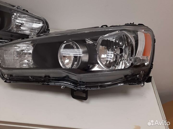 Фара левая Mitsubishi lancer 10