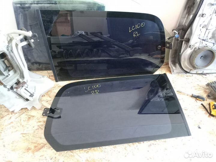 Стекло багажника левое Тойота Ленд Крузер 100