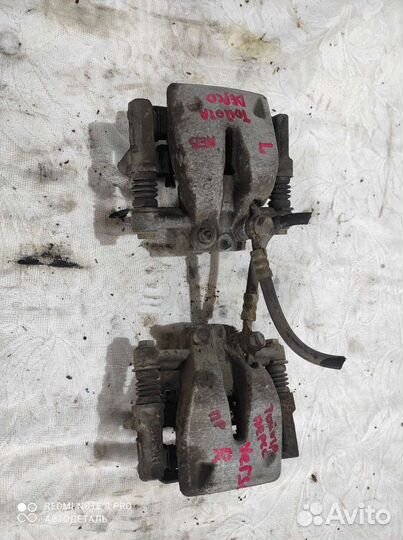 Суппорт В сборе toyota avensis corolla verso ADT25