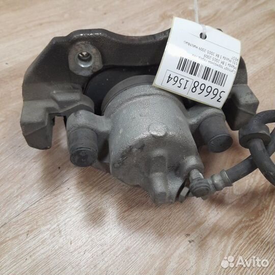 Суппорт тормозной передний левый Mazda 3 BK