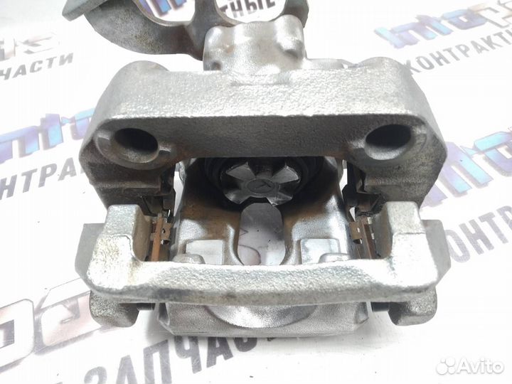 Суппорт задний левый Toyota Corolla 150