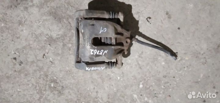 Суппорт тормозной передний левый Nissan Almera G15