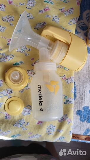Молокоотсос medela электрический