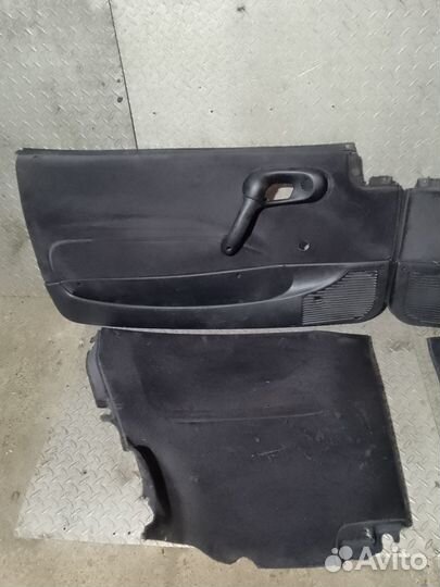 Обшивка дверей Опель Корса Б