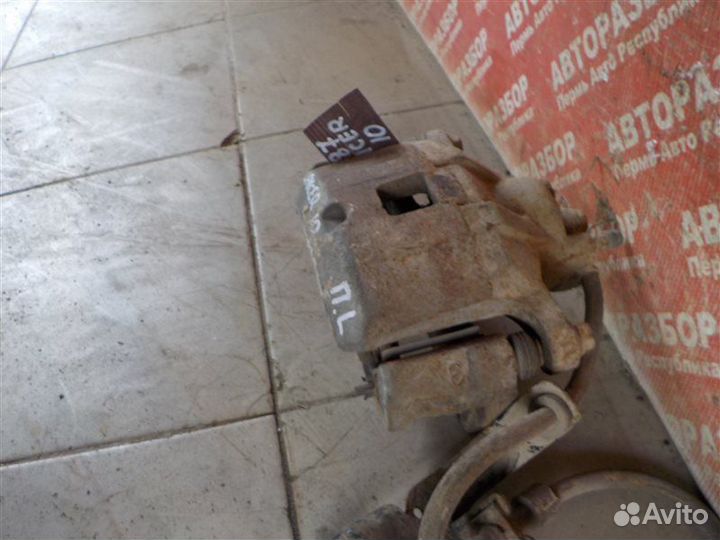 Суппорт тормозной передний левый Mitsubishi Lancer