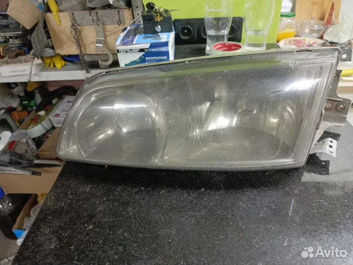 Фара левая Hyundai H-1 Starex рест. 2003
