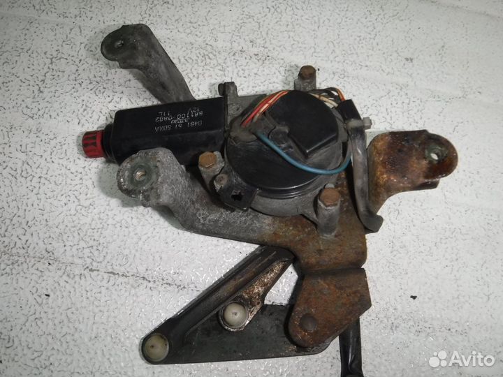 Моторчик стеклоочистителя фары Mazda 323