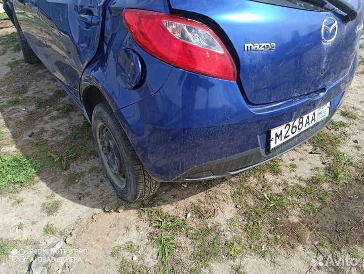 Задний бампер Mazda Demio DE3FS