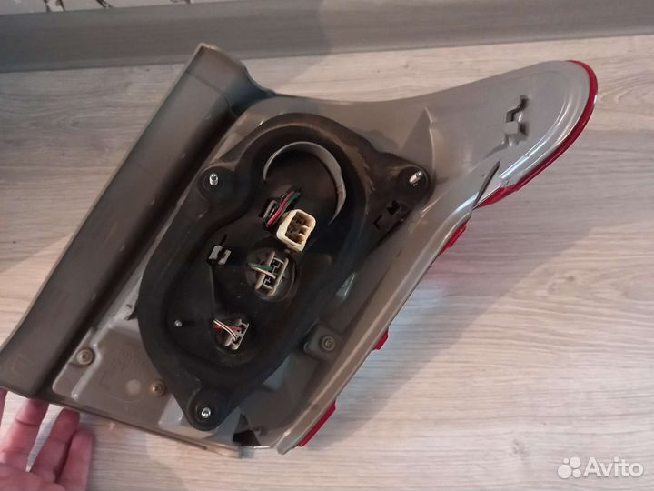 Фонарь(стоп сигнал)задний левый на Филдер