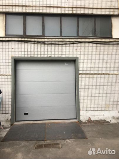 Подъемныe cекциoнные вopота Алютех