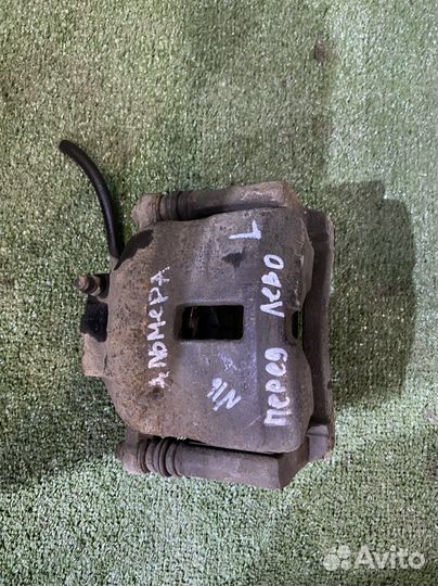 Суппорт тормозной передний левый Nissan Almera n16