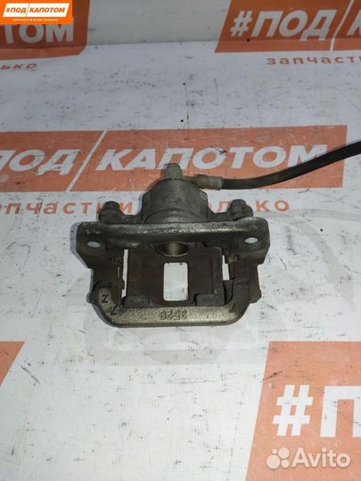 Суппорт тормозной задний левый Nissan X-Trail T31