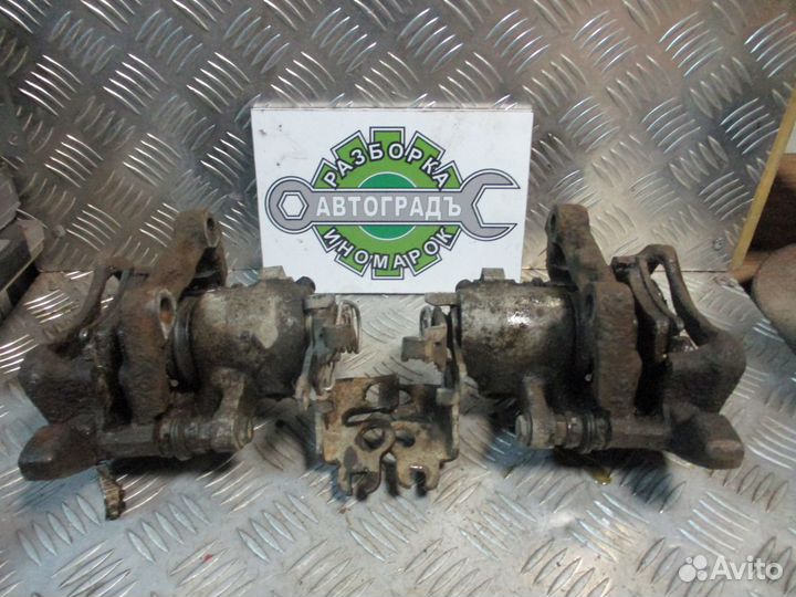 Суппорт тормозной задний L Volkswagen Caddy 3 07г