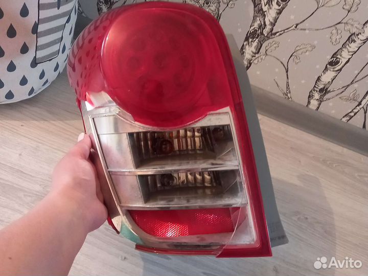 Фонарь(стоп сигнал)задний левый на Филдер