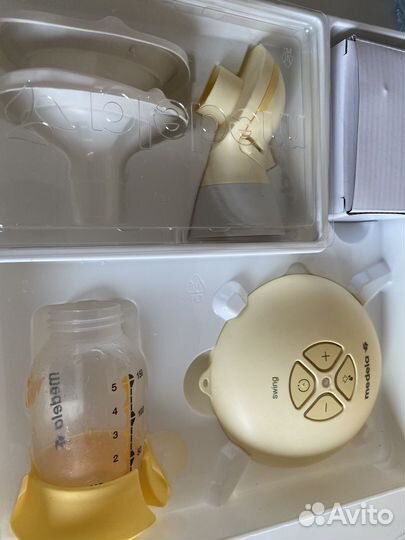 Молокоотсос medela электрический