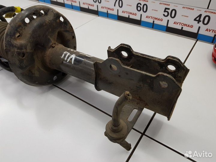 Амортизатор передний левый с пружиной