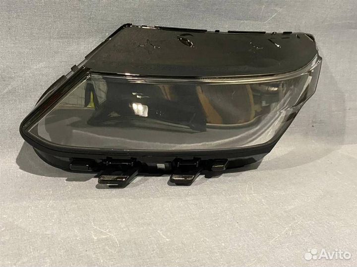 Стекло фары левой Geely Coolray