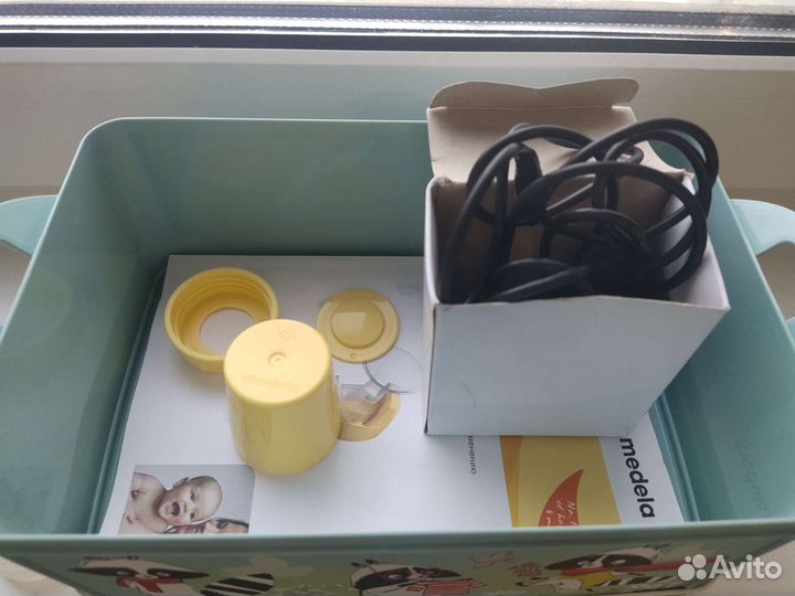 Молокоотсос medela электрический