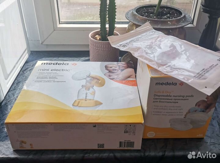 Молокоотсос medela электрический