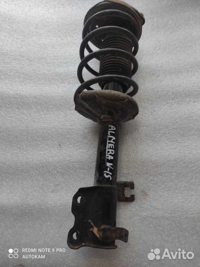 Стойка передняя левая Nissan Almera N15