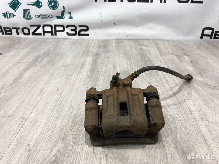 Суппорт тормозной задний левый Kia Ceed хэтчбек