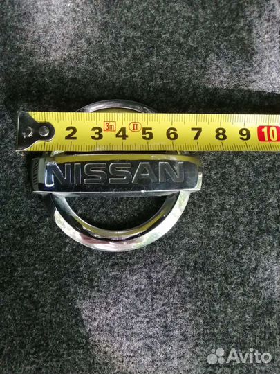 Эмблема Nissan