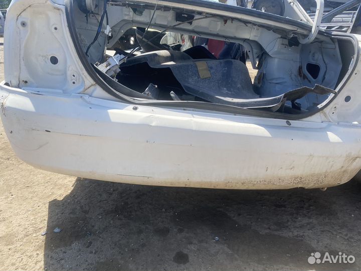 Бампер задний Mazda Familia