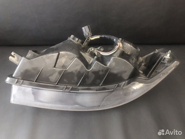 Фара правая черная 2601095F0E Almera Classic B10