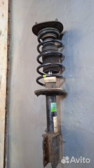 Стойка амортизатора передняя левая Mitsubishi Colt