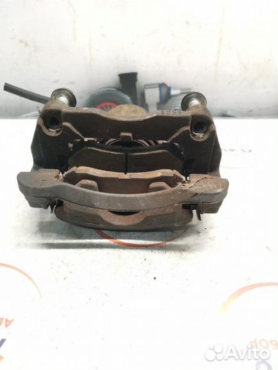 Суппорт тормозной передний левый Nissan Qashqai