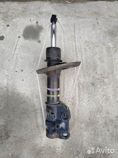 Стойка амортизатор, передняя, левая оригинал