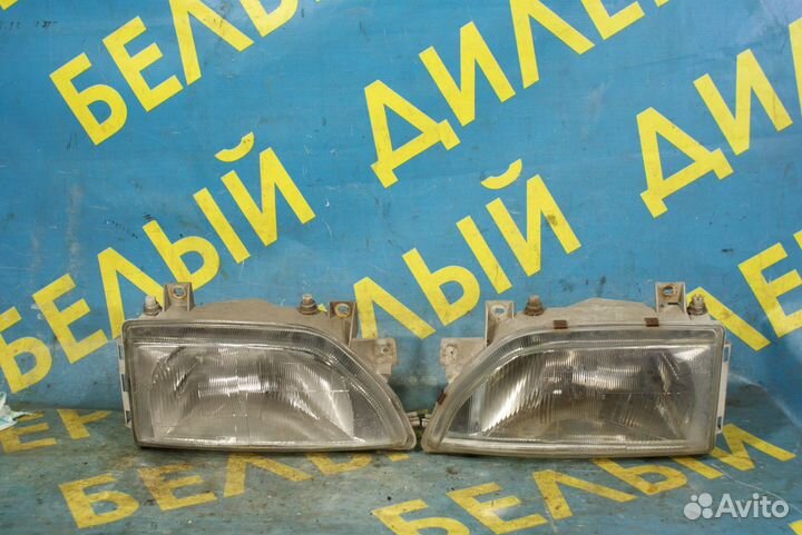 Передняя фара Ford Escort