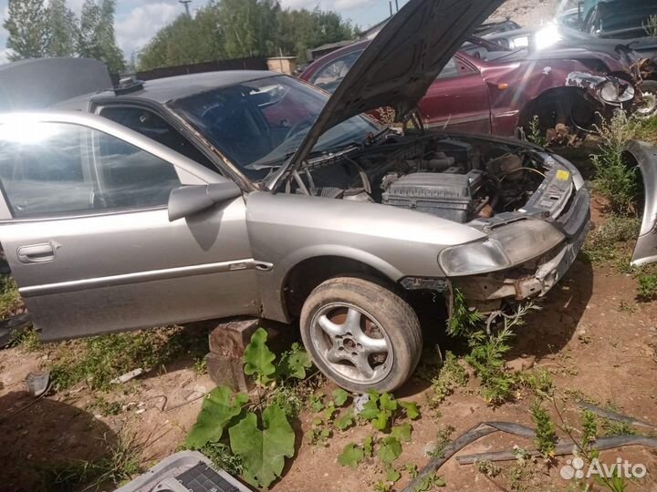 Замок багажника Opel Vectra B седан