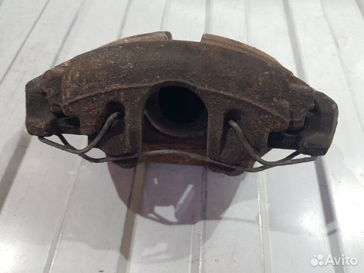 Суппорт тормозной передний левый Volkswagen Polo