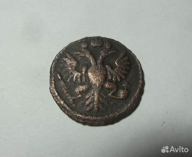 Монета Полушка 1734 перечекан из крестовой копейки