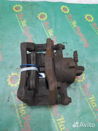 Суппорт передний левый Nissan Almera N16 хечбэк