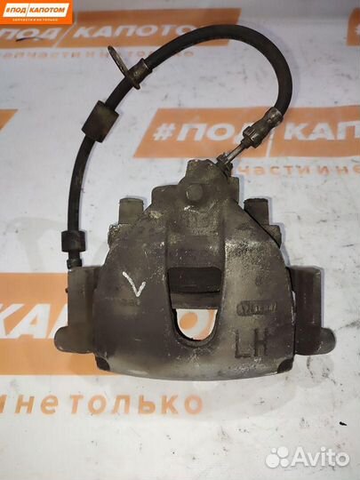 Суппорт тормозной передний левый Ford Focus