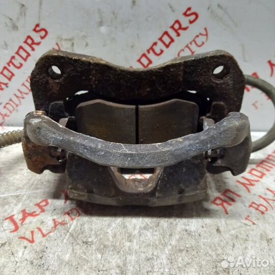 Суппорт тормозной передний Mitsubishi Lancer 9