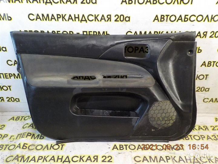 Обшивка двери передней левой Mitsubishi Lancer 9
