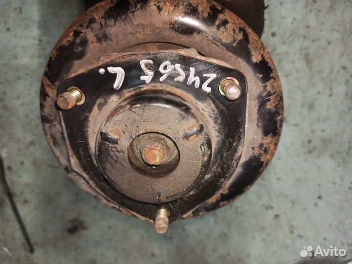 Стойка подвески передняя левая Nissan Primera P12