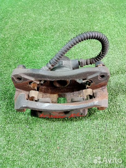 Суппорт тормозной задний левый Mitsubishi Pajero