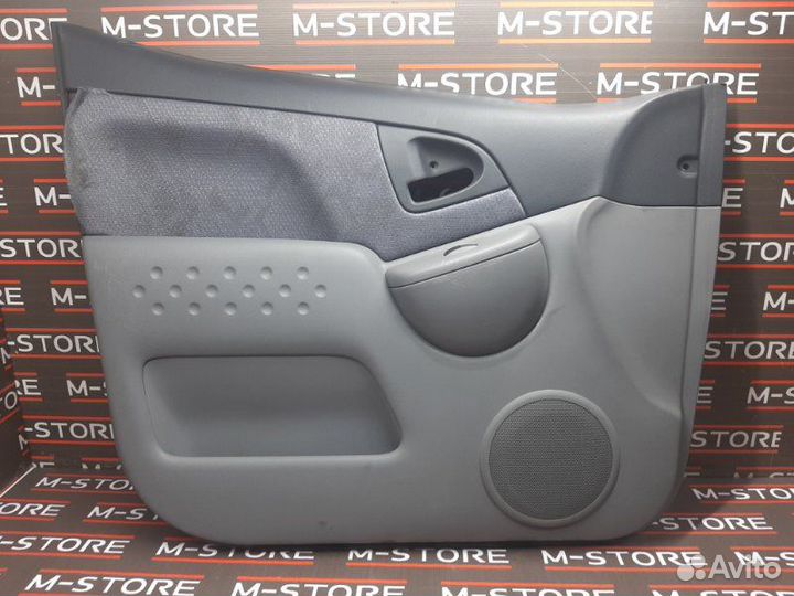 Обшивка двери передняя левая Toyota Funcargo NCP20