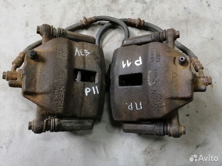 Суппорт тормозной передний для Nissan Primera P11E