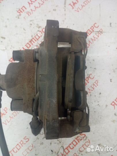 Суппорт тормозной передний левый Volkswagen Tiguan