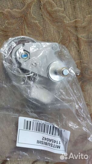 Натяжной ролик ремня грм Mitsubishi Outlander 2006