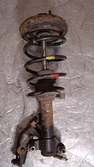 Стойка амортизатора передняя левая Nissan Primera