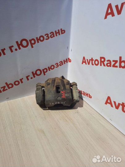 Суппорт передний левый Kia Carens 02-06г.в