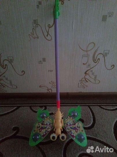 Игрушка - каталка новая, с ручкой